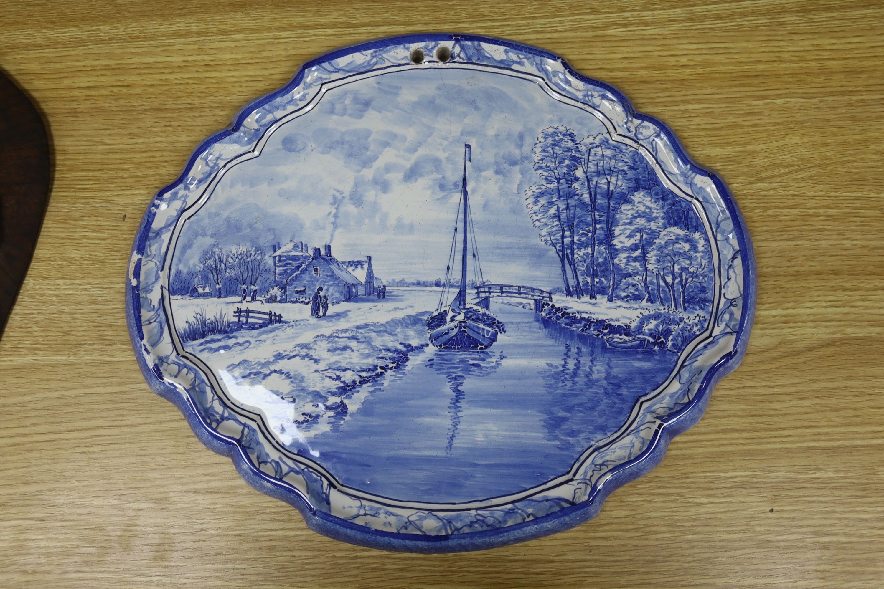 A Thoune, Swiss painted pottery dish, two Delft plaques and a Foresters jardiniere, largest 36cm